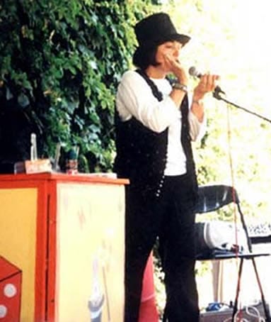 Magic Valery sings on a stage